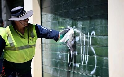 Council workers removed antisemitic slurs that were graffitied onto garage doors and cars in See Lane, Kingsford, Sydney, Sunday, February 2, 2025.