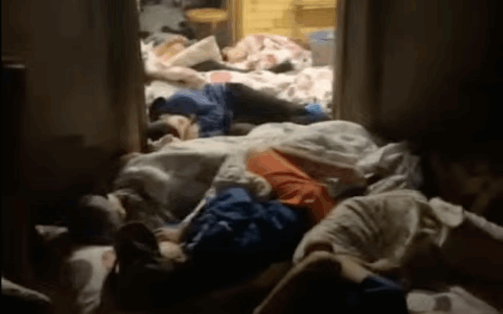 Camp Yeka children sleep on the floor of a bomb shelter in western Ukraine after drone sirens forced an overnight evacuation