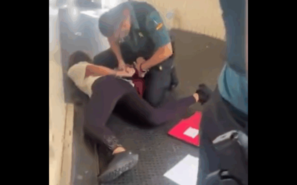 The director of a French Jewish summer camp being arrested by Spanish police after the group of Jewish teens were made to disembark from the plane