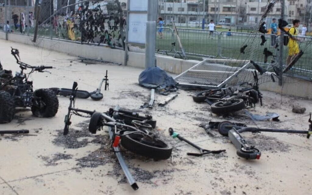 Scooters and bikes lay where they fell when a Hezbollah rocket slammed into this field in Majdal Shams, Israel, in 2024. (Photo by Elie Dahan)