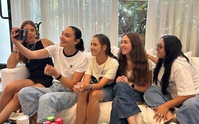 Gal Gadot (second from left) meets with freed hostages (from left) Moran Stela Yanai, Doron Steinbrecher, Naama Levy and Liri Albag. Photo Credit: Hostages Forum