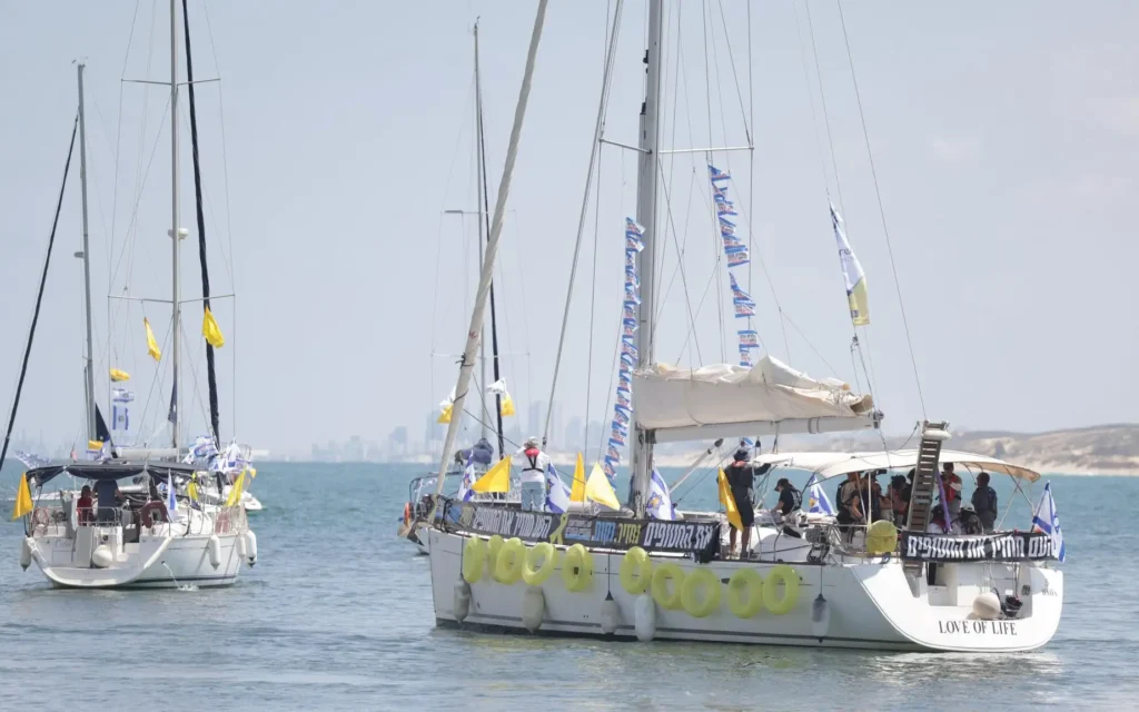 Boats carrying hostage families and supporters sail from Ashkelon toward the Gaza maritime border during Thursday's flotilla protest. Photo Credit: Hostages and Missing Families Forum