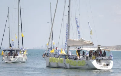 Boats carrying hostage families and supporters sail from Ashkelon toward the Gaza maritime border during Thursday's flotilla protest. Photo Credit: Hostages and Missing Families Forum