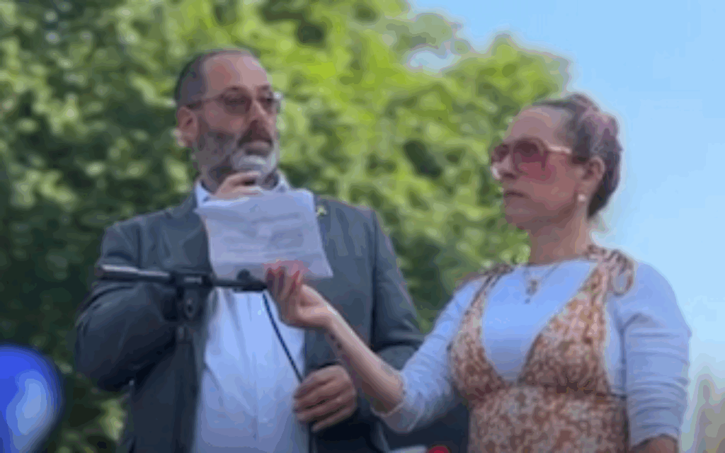 Rabbi Josh Levy and Rabbi Charley Baginsky speaking at communal rally before being forced to stop