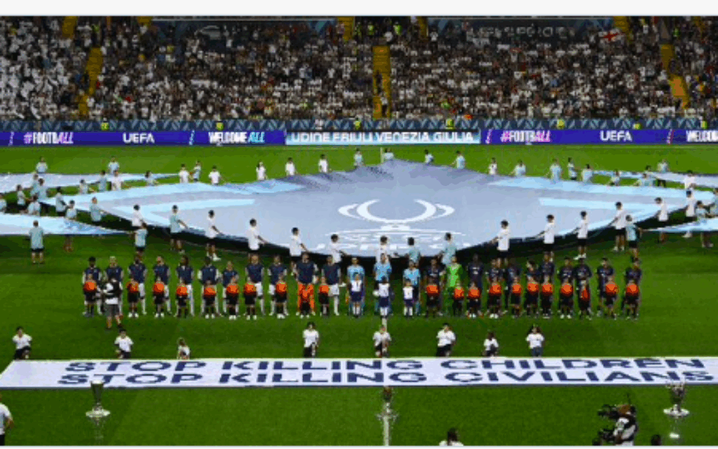 Banner on the pitch ahead of Super Cup game between PSG and Spurs
