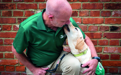 Noach Braun, co-founder of the Israel Guide Dog Center with Bessie (Adam Soller Photography©)