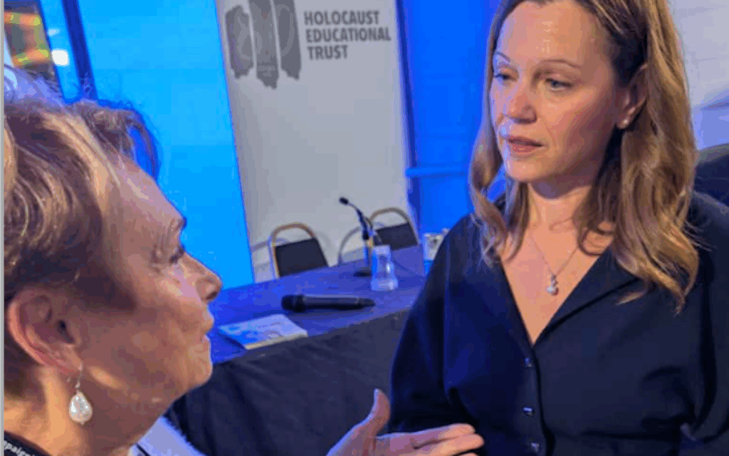 Survivor  Annick Lever BEM speaks with Lady Starmer at HET's Labour conference event
