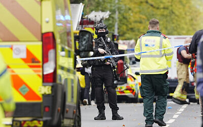 An armed police officer at the scene of an incident at Heaton Park Hebrew Congregation synagogue in Crumpsall, Manchester. PA Photo. Photo credit: Peter Byrne/PA Wire