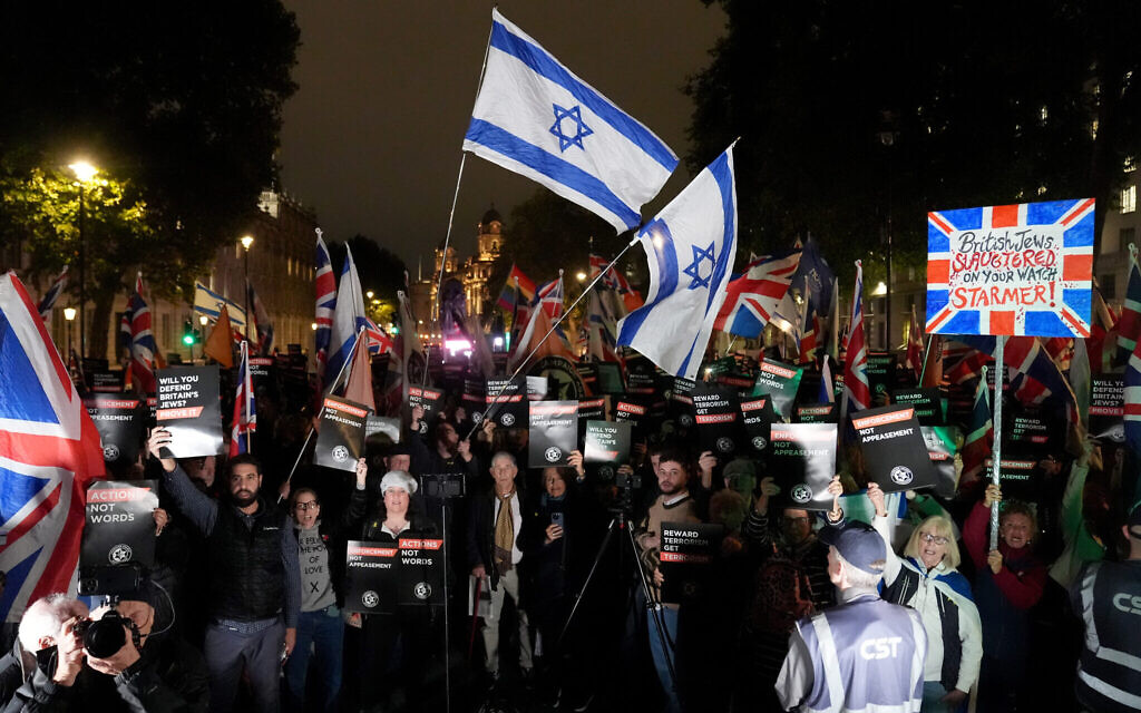 Protesters hold Israeli and Union flags during a Campaign Against Antisemitism rally outside Downing Street, London, marking one week since the Manchester synagogue attack. Credit: Jonathan Brady/PA Wire