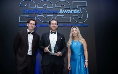 Bright Futures UK founder Joshua Pelled (centre) receiving the Charity of the Year 2025 award at the Charity Times Awards. Photo: Courtesy