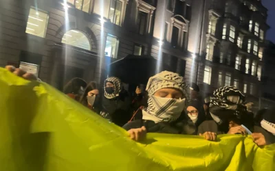 Masked protesters demonstrate outside a central London venue hosting a talk on Hamas sexual violence during the 7 October attacks. Credit: Nicole Lampert