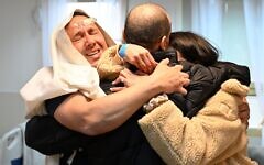 Eli Sharabi (black jacket) is reunited with his brother Sharon and his sisters Osnat and Hila at Sheba Medical Center after he was released by Hamas on Saturday, February 8, 2025, along with two other male hostages as part of a cease-fire agreement between Israel and the terrorist group. The men spent 491 days in captivity after being abducted on October 7, 2023. Credit: UPI/Alamy Live News