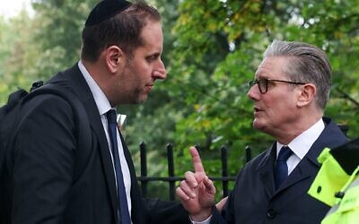 Prime Minister Sir Keir Starmer speaks with a member of the Jewish community at the scene near Heaton Park Hebrew Congregation synagogue in Crumpsall, Manchester, where two people died in a terror attack. Picture date: Friday October 3, 2025.