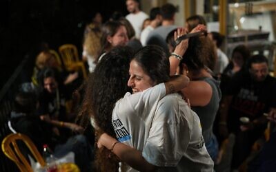 Relatives and supporters of Israeli hostages held by Hamas in the Gaza Strip celebrate after the announcement that Israel and Hamas have agreed to the first phase of a peace plan, as they gather at a plaza known as the hostages square in Tel Aviv, Israel, Thursday, Oct. 9, 2025. (AP Photo/Emilio Morenatti)