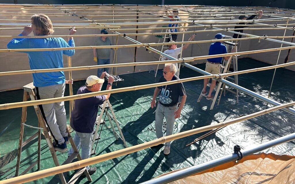 Members of Temple Isaiah’s Men’s Club, Anshei Isaiah, build a new sukkah for the Pasadena Jewish Temple and Center. (Courtesy Temple Isaiah)