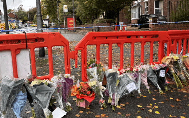 Floral tributes laid outside Heaton Park Synagogue in memory of the victims of the Yom Kippur attack.