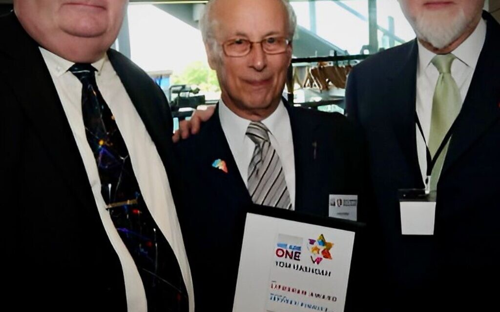 Jeffrey Pinnick receiving receiving an award for lifetime contribution to Holocaust remembrance at Yom HaShoah commemoration in 2016. It was presented by Lord Pickles and Henry Grunwald