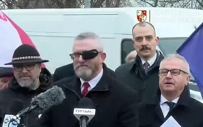 Grzegorz Braun, pictured, centre; Twitter/X