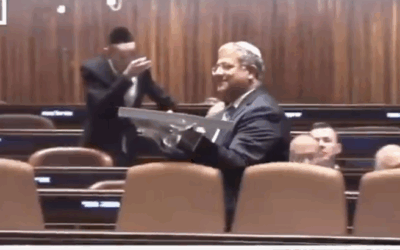 National Security Minister Itamar Ben-Gvir holds a placard in the Knesset chamber during the debate on the death penalty bill, 10 November 2025. Credit: Knesset Channel 99 / Screenshot