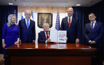 Donald Trump signs the guest book at the Israeli Knesset