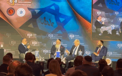Manchester Rabbi Daniel Walker speaking alongisde Boris Johnson in Poland on Monday
