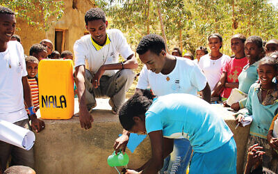 Young community members take part in a hygiene and sanitation activity run by NALA, an Israeli NGO working to combat neglected tropical diseases. Photo: NALA