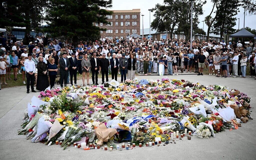 Australia in mourning after gunmen opened fire on Bondi Beach, killing 15 people in an attack designed to target the Jewish community. (AAP Image/Bianca De Marchi) Credit: Australian Associated Press/Alamy Live News