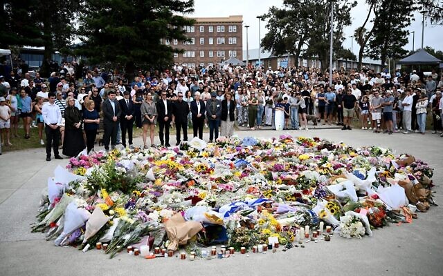 Australia in mourning after gunmen opened fire on Bondi Beach, killing 15 people in an attack designed to target the Jewish community. (AAP Image/Bianca De Marchi) Credit: Australian Associated Press/Alamy Live News