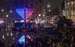 The giant menorah is lit in Trafalgar Square during ChanukahLIVE!, as crowds gather for the annual public celebration in central London. Credit: Mark Thomas