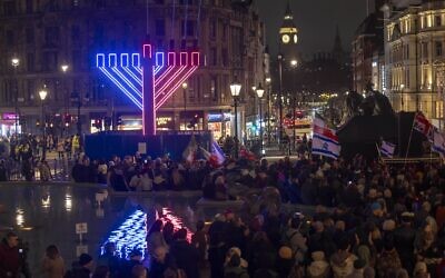 The giant menorah is lit in Trafalgar Square during ChanukahLIVE!, as crowds gather for the annual public celebration in central London. Credit: Mark Thomas
