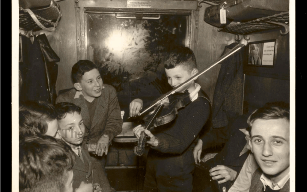 Jewish refugee boys from Germany playing violin on train to the Netherlands, Wiener Holocaust Library collections.