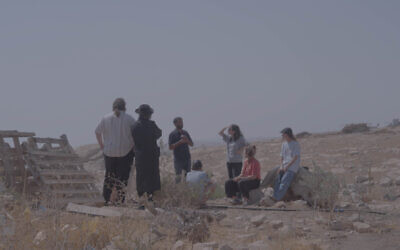 Bnei Avraham volunteers meeting with Palestinian residents during a protective presence visit in the South Hebron Hills. (Photo: Bnei Avraham)