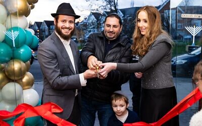 Rabbi and Rebetzen Schochet of Mill Hill East Chabad cut the ribbon to officially open the new Centre. Pic: Michael Lee.