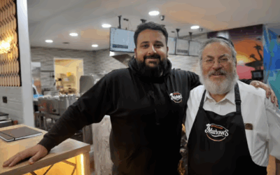 Arabaab “Paddy” Munir with Rabbi Anthony Gilbert outside Marlow’s British Kitchen, the Leeds chippie now serving kosher fish and chips for the first time in 50 years. Photo: Steve Riding
