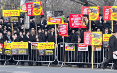 Strictly orthodox Jews protesting outside the Israeli embassy in Kensington today (Picture: Lee Harpin)
