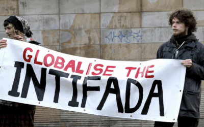Pro-Palestinian demonstrators hold a banner reading “Globalise the intifada”. Credit:
American Jewish Committee (AJC)