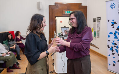 Nicole Lampert (left) receives the Pete Newbon award from Heidi Bachram (pic Lakruwan Rajapaksha.)