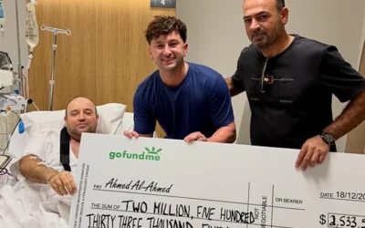 Ahmed al Ahmed receives a £1.2 million cheque at his Sydney hospital bed after confronting a Bondi gunman.