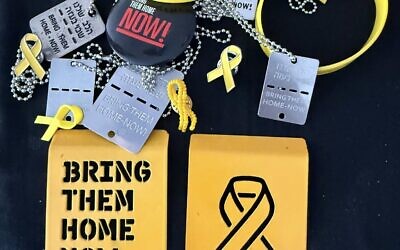 Yellow ribbons, dog tags and bracelets advocating for the release of the hostages.