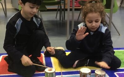 Pupils at Kerem School playing the Indian Tabla drum