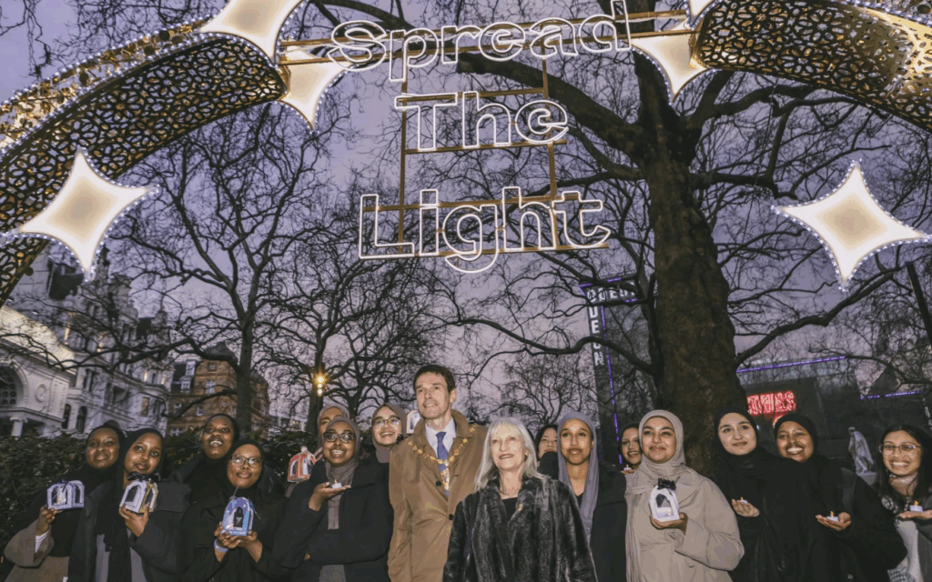 Members of the Aziz Foundation community gather beneath the Ramadan Lights installation in London’s West End, as the foundation launches its first interfaith art exhibition, Shared Light, as part of Ramadan Lights London 2026.
Photo Credit: Aziz Foundation