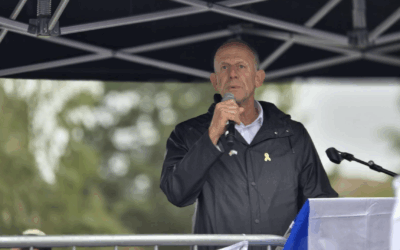 Mark Adlestone OBE speaking at a community rally in Greater Manchester.