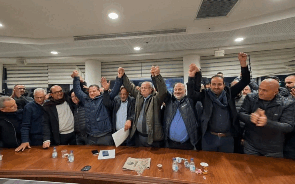 The leaders of the four parties celebrate following the agreement to revive the Joint List