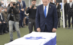 Prime Minister Benjamin Netanyahu stands beside the flag-draped coffin of Ran Gvili at his funeral in Meitar on January 28, 2026. Credit:
X / GPO Prime Minister Benjamin Netanyahu stands beside the flag-draped coffin of Ran Gvili at his funeral in Meitar on January 28, 2026. Credit:
X / GPO
