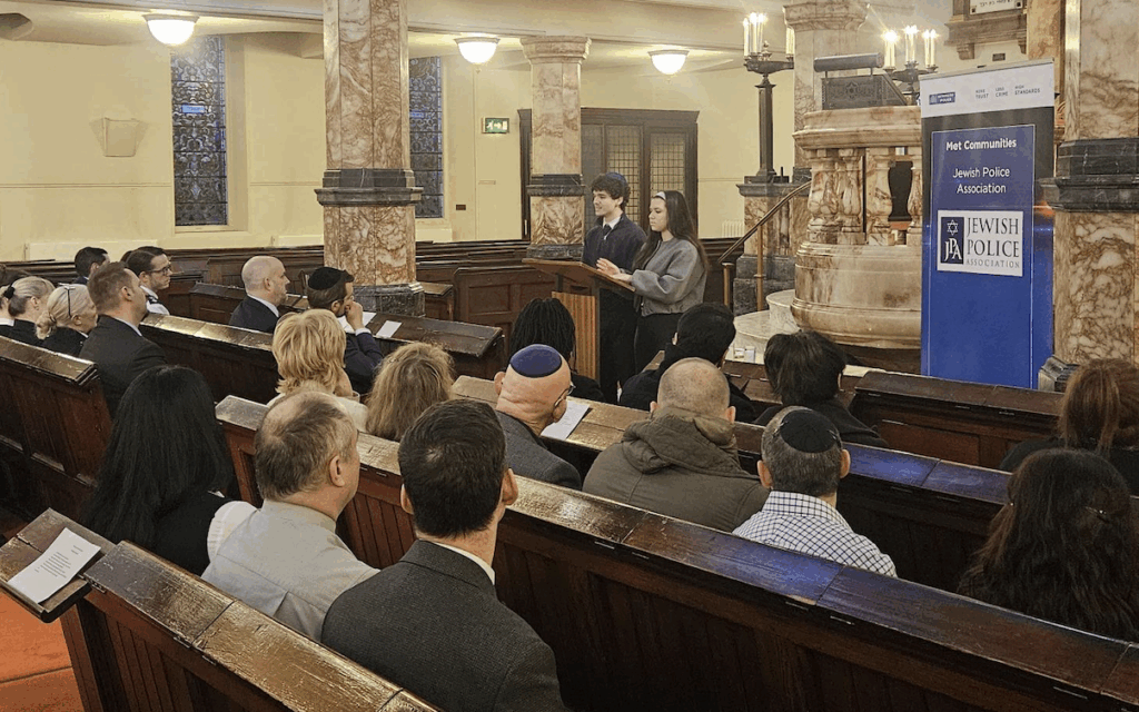 Head boy Harry Patnick and head girl Tamar John of Yavneh College address the audience during the Metropolitan Police Service Holocaust Memorial Day ceremony at Hampstead Synagogue.