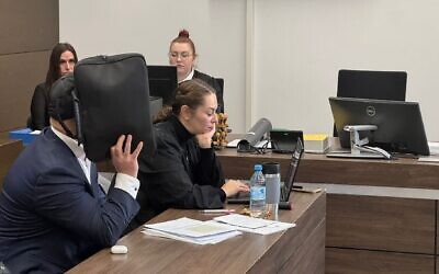 A rabbi and defendant in a court case appears in the district court in Tiergarten, Berlin, Jan. 16, 2026. His attorney, Galina Rolnik, sits next to him. (Courtesy)