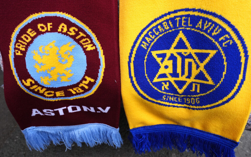 Aston Villa and Maccabi Tel Aviv club badges on a scarf.  Local political pressure may have played a part in the decision to ban Maccabi Tel Aviv football fans from attending a match against Aston Villa, a committee of MPs has concluded.