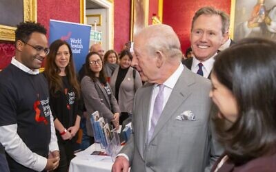 His Majesty The King speaks with World Jewish Relief staff and refugee professionals during a jobs fair hosted by the Royal Household at St James’s Palace. Credit: World Jewish Relief
