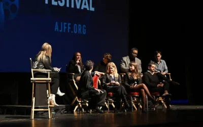 From left to right: Meghan Leathers, Jon Bass, Theo Taplitz, Kyra Sedgwick, Method Man, Milana Vayntrub, Adam Mitchell, and Daniel Robbins speak onstage during the 25th Atlanta Jewish Film Festival 'Bad Shabbos' opening night premiere at Cobb Energy Performing Arts Center on February 19, 2025, in Atlanta, Georgia. (Derek White/ AFP)