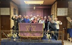 Council members of the two communities come together to celebrate the merger, February 2026